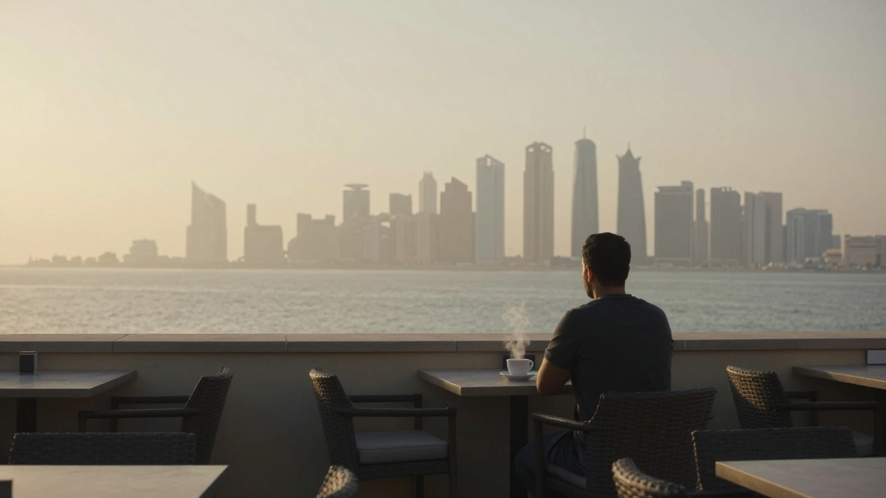 A man alone at a rooftop café at dawn, overlooking Abu Dhabi's waterfront.